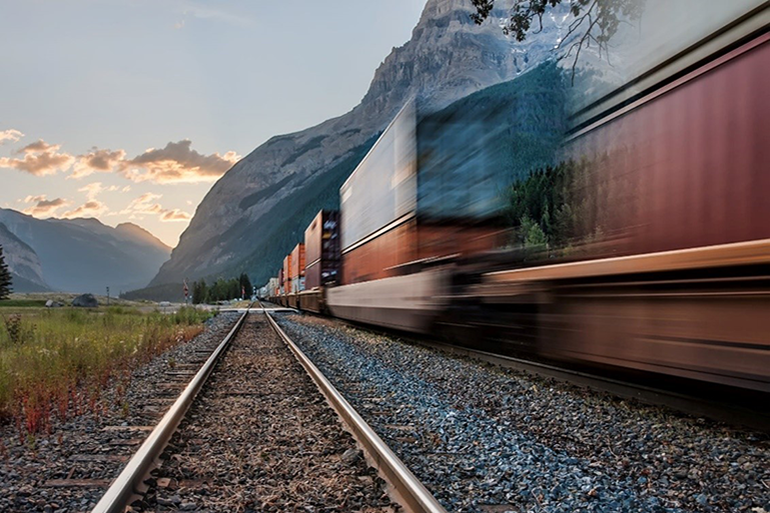 Speeding cargo train on railway